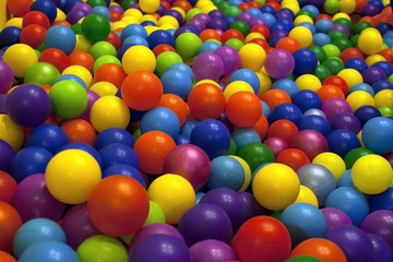 Fototapeta na wymiar Children's playroom. Bright colored balls of plastic for baby dr