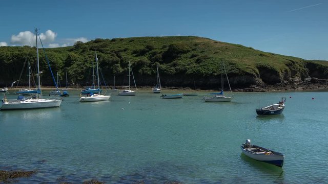 epic timelapse shot filmed over 7 hours of  the port of Solva in Wales. during this long period of time the water empties out of the bay into the sea leaving the boats stranded in sand