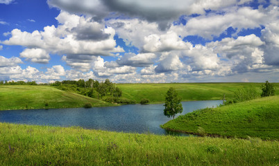 Summer landscape with river and meadows