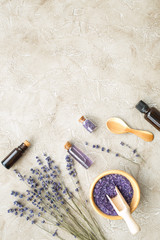 Essential oil and lavender salt with flowers top view