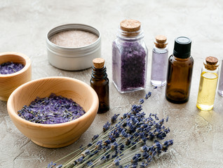 Obraz na płótnie Canvas organic cosmetics with lavender on wooden background