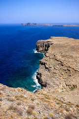 Fototapeta na wymiar Coastal Greece, picture of the rocky coast of Greece , with blue skies and clear waters