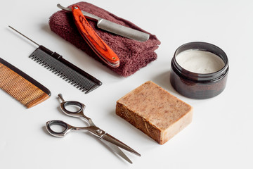 white desktop with tools for shaving beards