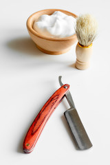 white desktop with tools for shaving beards