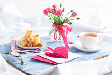 Morning Valentine's breakfast on blue wooden tray