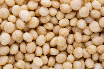 Corn flakes rings on the background.