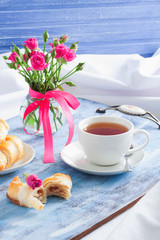 Morning Valentine's breakfast on blue wooden tray