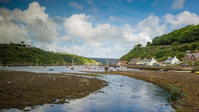 epic timelapse shot filmed over 7 hours of  the port of Solva in Wales. during this long period of time the water empties out of the bay into the sea leaving the boats stranded in sand