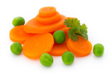 Carrot slice, green peas, isolated on white.