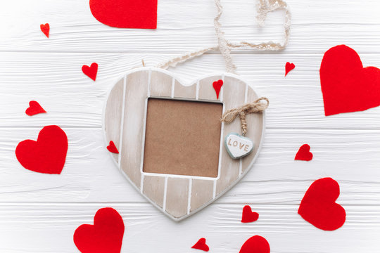 Valentines day . Heart of felt, gifts ,photo frame and decor  on wooden background