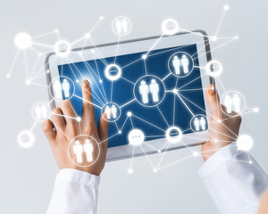 Close of female doctor hands working with tablet pc computer