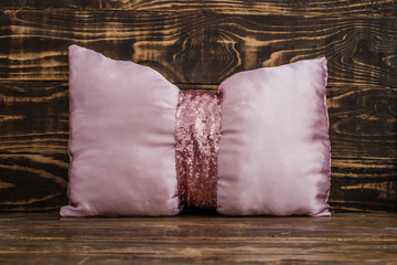 Decorative Pink Pillow  on Brown Wooden Background