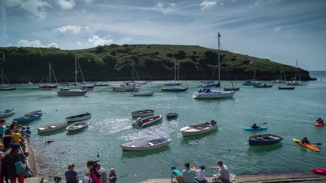 epic timelapse shot filmed over 7 hours of  the port of Solva in Wales. during this long period of time the water empties out of the bay into the sea leaving the boats stranded in sand