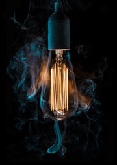 vintage lightbulb surrounded with smoke