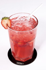 Strawberry juice with ice cubes and a slice of strawberry isolated on white background