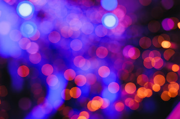 Defocused lights. Colored abstract blurred light background. Concept or festival background....