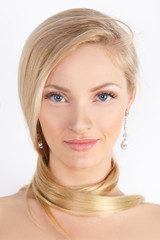 Fototapeta premium Beauty Spa Woman with perfect face skin Portrait. Beautiful blonde Isolated on white. Natural make-up, blue eyes, pink gloss on her lips, long eyelashes