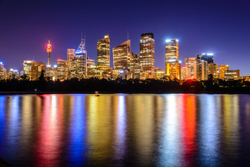 Obraz premium mirrored Sydney Skyline in the water after sunset , Australia