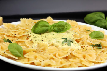 Delicious creamy Italian penne pasta starter with pepper seasoni