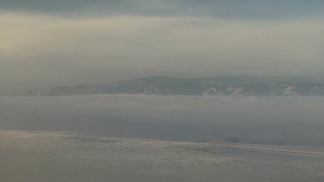 Valley Fog Swirls During Winter Day