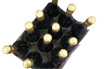 Top view of twelve bottles of wine with gold foil tops.