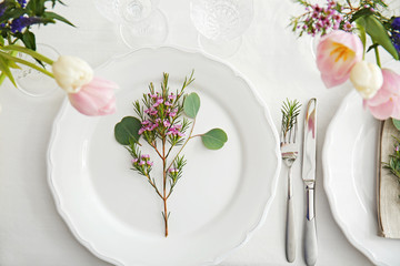 Flower arrangement on table served for wedding dinner
