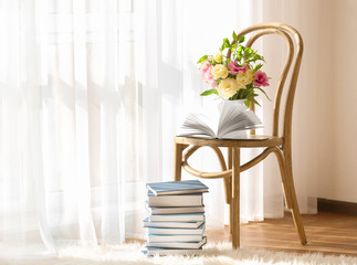 New books on wooden chair indoors