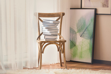 New books on wooden chair indoors