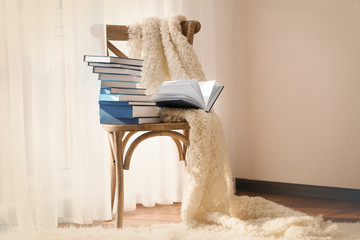 New books on wooden chair indoors
