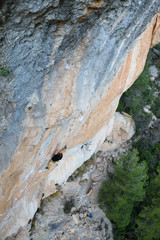 Extreme sport climbing. Rock climber struggle for success. Outdoor lifestyle. Siurana, Spain.