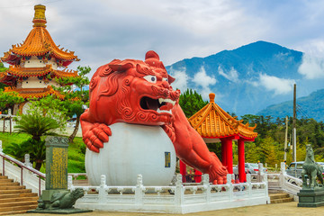 A Chinese Guardian Lion with the ball can be seen at the main entrance outside of Wenwu Temple in Puli County of Taiwan