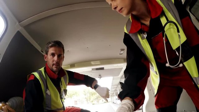 Paramedic using an external defibrillator 