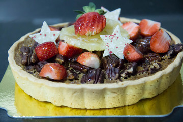 A pecan pie on  board