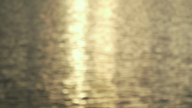 Sun glints. Reflection of sunlight in water