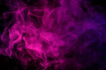 Abstract smoke Weipa. Personal vaporizers fragrant steam. The concept of alternative non-nicotine smoking. Magenta smoke on a black background. E-cigarette. Evaporator. Taking Close-up. Vaping.