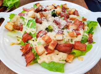 Bacon salad on white dish, selective focus