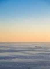 Fototapeta na wymiar Transport ship at sunset