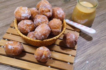 Sweet donuts in the wicker basket Fat Thursday Slavic culture 
