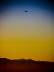 Plane departing over the mountains
