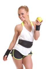 young fitness woman happy smiling holding apple