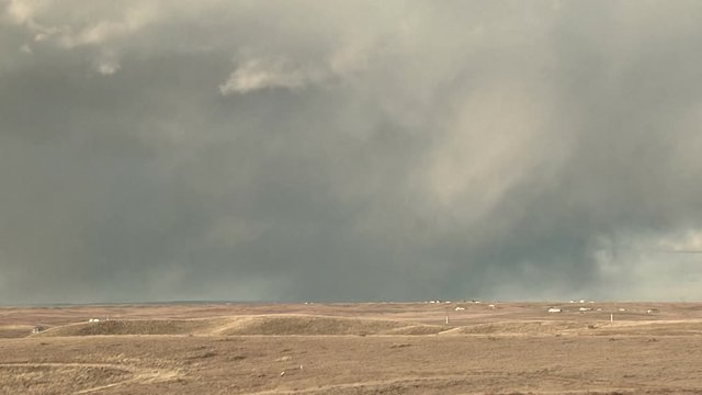 Rain Squalls Sweep Across Bone Dry Farmlands