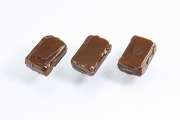 caramel candies on white