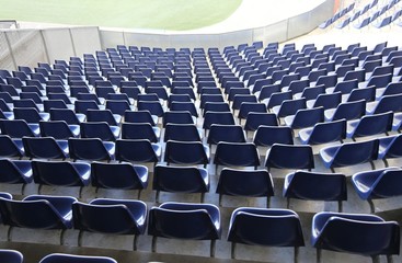 Naklejka premium chairs with no spectators on the stadium bleachers