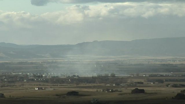 Grassfire Smoke in Farmland Blowing in Wind