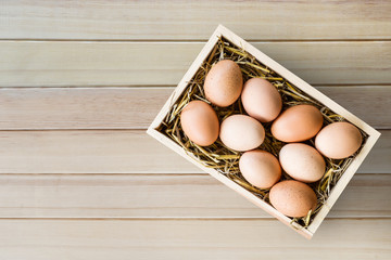 Chicken eggs in wood box