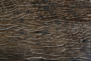 Closeup of dark wood background.