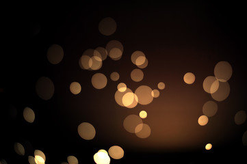 Abstract gold bokeh with black background