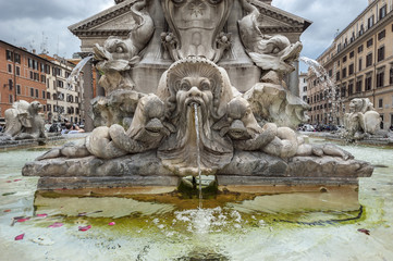Fototapeta na wymiar In the center of the piazza is a fountain, the Fontana del Pantheon, surmounted by an Egyptian obelisk. The fountain was constructed by Giacomo Della Porta under Pope Gregory XIII in 1575
