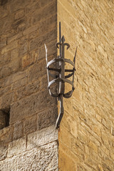 Old torch holder in Florence, Italy