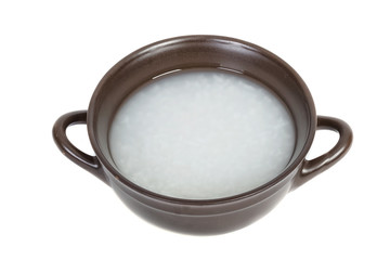 Fototapeta na wymiar Bowl of Rice Porridge or Soft Boiled Rice with Wooden Chopsticks